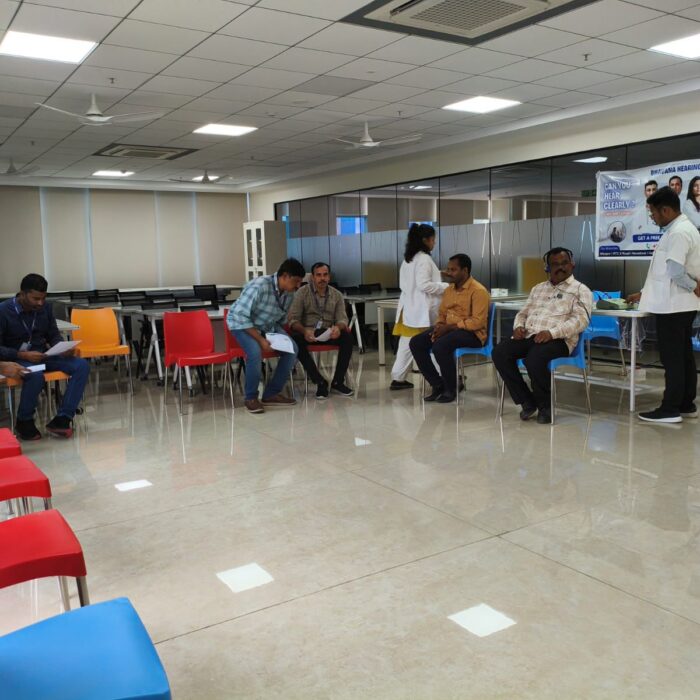 “Audiologist conducting a free professional hearing test at a community hearing camp.