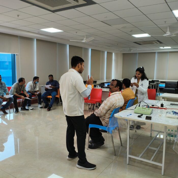 Audiologist performing a complimentary hearing test at a free hearing camp