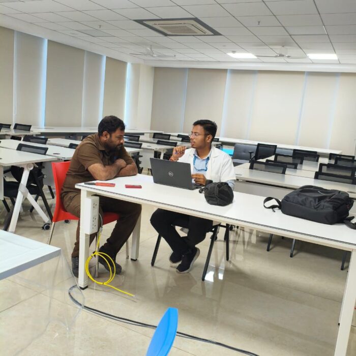 Audiologist conducting a free hearing test for a patient during a hearing camp.